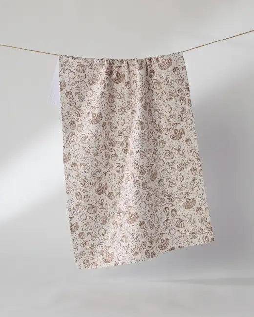 A Geometry Cozy Flora kitchen tea towel on display